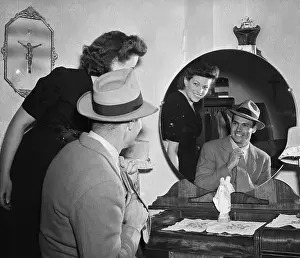 Charles W. Hesser Putting on Suit