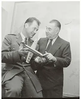 Charles Yeager and Lawrence Bell Observing Plane Model