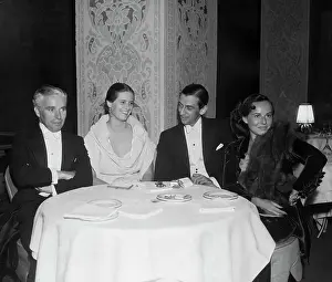 Charlie Chaplin Chatting with Colleagues