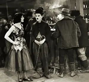 Prints of (Original Caption). Charlie Chaplin and Georgia Hale in a scene from The Gold Rush. 1925 Master of Mime, Icon of Cinema: Chaplin in Prints: Charlie Chaplin with Hat and Cane
