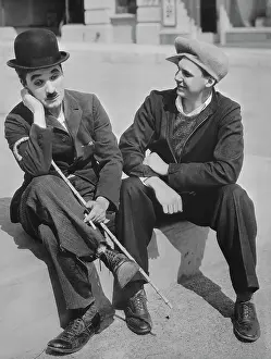 Charlie Chaplin and Jackie Coogan Reenacting a Movie Scene