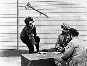 Prints of (Original Caption). Guaranteed Pictures Co. Inc. presents The Charlie Chaplin Festival. (Scene from The Immigrant.) 1917 Master of Mime, Icon of Cinema: Chaplin in Prints: Charlie Chaplin (Left) in Film Scene