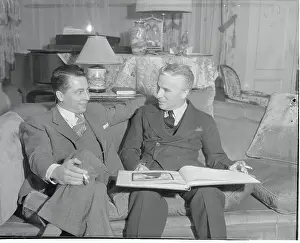Charlie Chaplin Looking Through Art Book