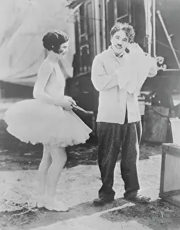Prints of (Original Caption). Charlie Chaplin and Merna Kennedy in movie still from The Circus Master of Mime, Icon of Cinema: Chaplin in Prints: Charlie Chaplin and Merna Kennedy in The Circus