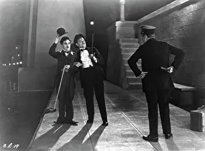 Prints of (Original Caption). Charlie Chaplin in City Lights. United Artists movie still. Made in U.S.A Master of Mime, Icon of Cinema: Chaplin in Prints: Charlie Chaplin In Movie Scene
