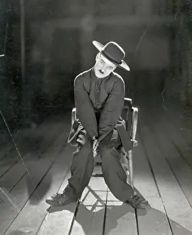 Prints of (Original Caption) 1922-Charlie Chaplin depicted alone in the 1923 release of The Pilgrim, a silent comedy directed by Chaplin in which he plays an escaped convict Master of Mime, Icon of Cinema: Chaplin in Prints: Charlie Chaplin in The Pilgrim