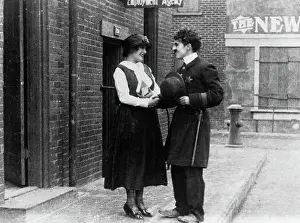 Prints of (Original Caption). Guaranteed Pictures Co. Inc. presents The Charlie Chaplin Festival. (Scene from Easy Street.) 1917 Master of Mime, Icon of Cinema: Chaplin in Prints: Charlie Chaplin in Police Uniform