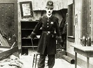 Prints of (Original Caption). Guaranteed Pictures Co. Inc. presents The Charlie Chaplin Festival. (Scene from Easy Street.) 1917 Master of Mime, Icon of Cinema: Chaplin in Prints: Charlie Chaplin in Police Uniform