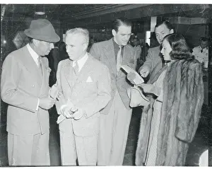 Charlie Chaplin and Others at Race Track