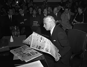 Charlie Chaplin Reading a Newspaper