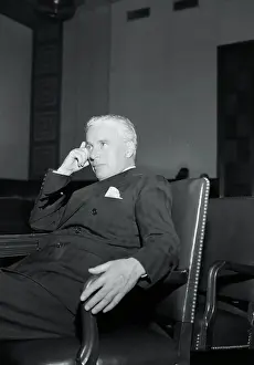 Charlie Chaplin Resting in a Chair