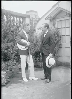 Prints of (Original Caption). Charlie Chaplin Travels To New York To Attend To Some Film Business Master of Mime, Icon of Cinema: Chaplin in Prints: Charlie Chaplin and Secretary Outdoors