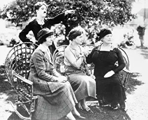 Prints of (Original Caption). Keeper of the Flame (seventh of ten). In California to act in a silent film, Miss Helen Keller (seated center) met movie comedian Charlie Chaplin in 1918 Master of Mime, Icon of Cinema: Chaplin in Prints: Charlie Chaplin and Others in a Silent Film