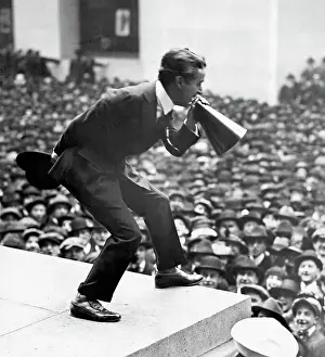 Prints of (Original Caption) 1917-New York, NY: Charlie Chaplin addressing crowds via megaphone on the steps of Sub-treasury Building in New York during World War I third Liberty Loan Rally Master of Mime, Icon of Cinema: Chaplin in Prints: Charlie Chaplin Speaking at War Rally