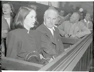Charlie Chaplin and Wife Watching Tennis Match