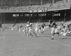 Charlie Connerly Carrying Football