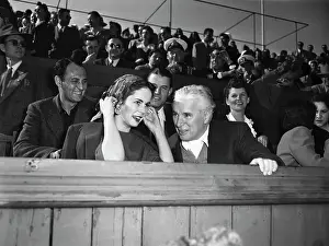 Oona Oneill Prints: Charlie and Oona Chaplin Watching a Tennis Match