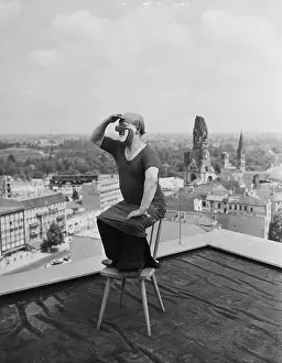 Charlie Rivel Performing on a Rooftop