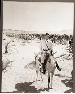 Charlton Heston Leading a Camel Charge