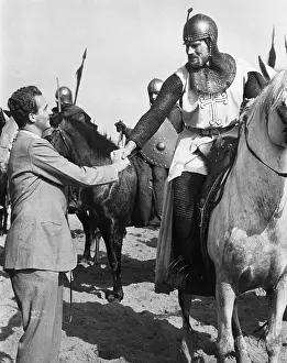 Equestrians Prints: Charlton Heston Shakes Hands with Juan Carlos