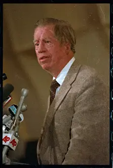 Chemist Dr. R. Bruce Merrifield Speaking into Mic