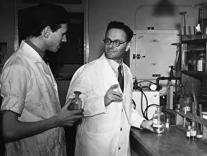 Chemist Hans Adolf Krebs and Assistant in Laboratory