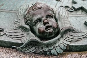 Images Dated 26th October 2014: Cherubs face on a grave of Augustin EhrensvAÔé¼rd at Suomenlinna, Finland