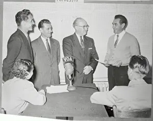 Munich Prints: Chet Hollifield and Refugees Near Broadcasting Microphone