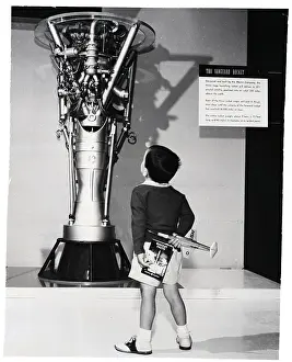 Child Admires The G.E. Rocket Engine