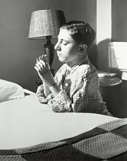 Amputee Prints: Child with Artificial Arms Praying
