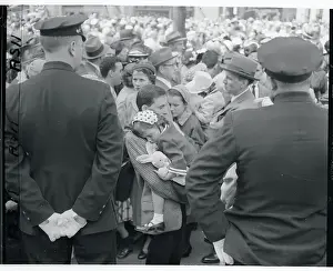 Comfortable Prints: Child Asleep in Crowd