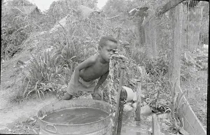 Mississippi Prints: Child Drinking Water from Pipe