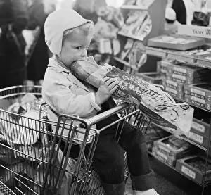 Hungry Prints: Child Eating a Loaf of Bread