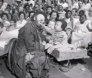 Child Feeding Clown
