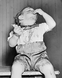 Ice Cream Prints: Child Making Mess While Eating Ice Cream Cone