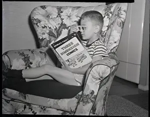 Child In Seat Reading 3D Comic