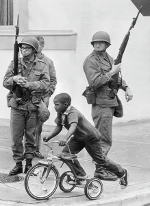 Tricycle Prints: A Child Tricycles Past Federal Troops