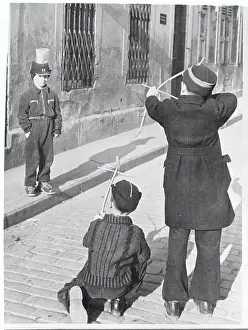 Stuttgart Prints: Child Wearing a Can on His Head for a Target