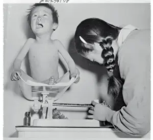 Busan Prints: Child Being Weighed on Scale