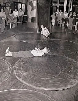 Lying On Back Prints: Children (10-12) on whirling discs at Coney Island