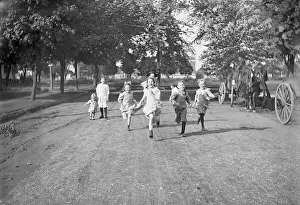 Pre Teen Girl Prints: Children (3-12 years) running dirt road. 1925