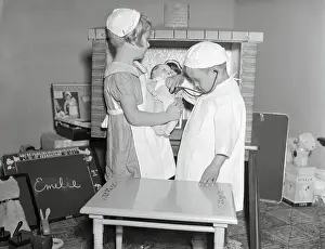 Children (6-9) Wearing Costumes Playing Doctor and Nurse
