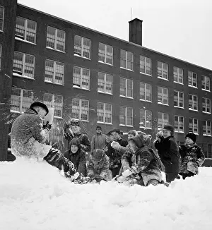 Schoolboy Prints: Children (8-9 years) Play in Snow Outside School