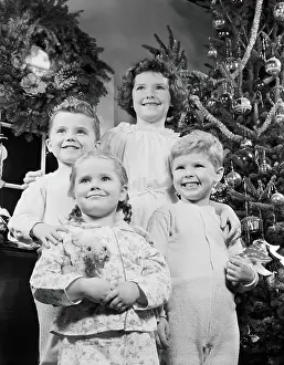 Image Created 1950s Prints: Children in front of Christmas tree