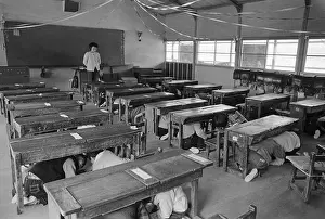 Earthquake Prints: Children Crouched Under Schoolroom Desks