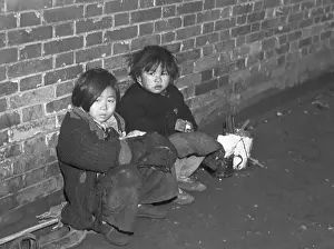 Starvation Prints: Children Huddled Against Wall