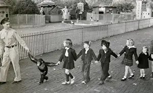 Baby Animal Prints: Children Being Led By Zookeeper, Chimp