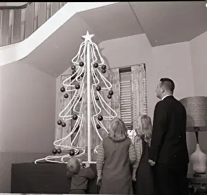 Tube Prints: Children Look at Copper Tube Christmas Tree