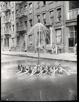 Swim Trunks Prints: Children Lying Under a Sprinkler on a Hot Day