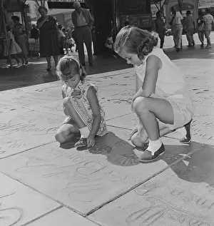 Graumans Chinese Theater Prints: Children Observing Marilyn Monroe's Footprints